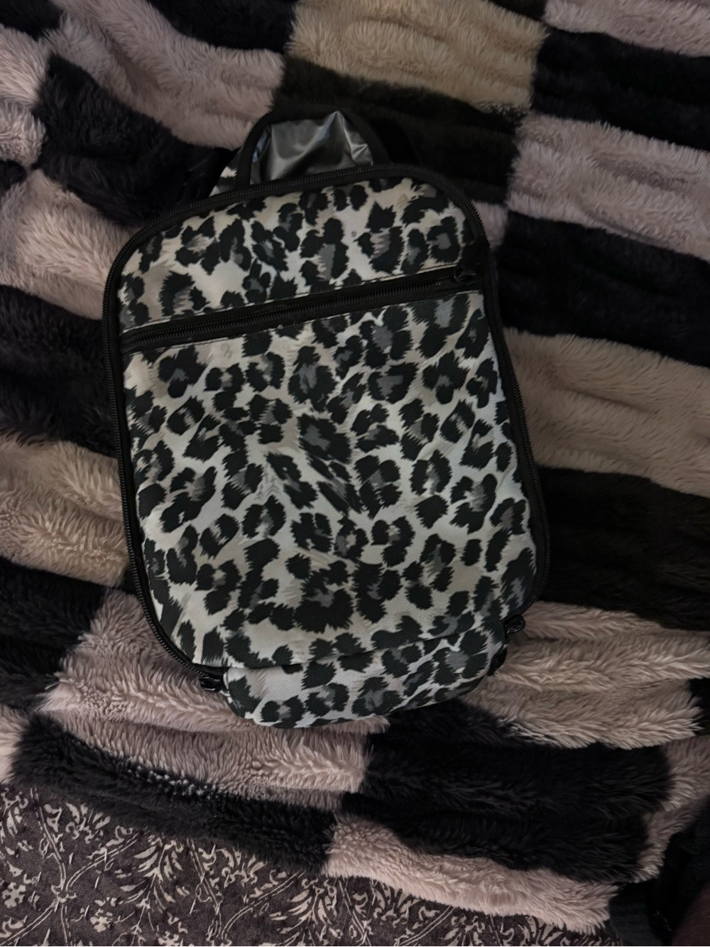 Black and gray leopard patterned lunchbox